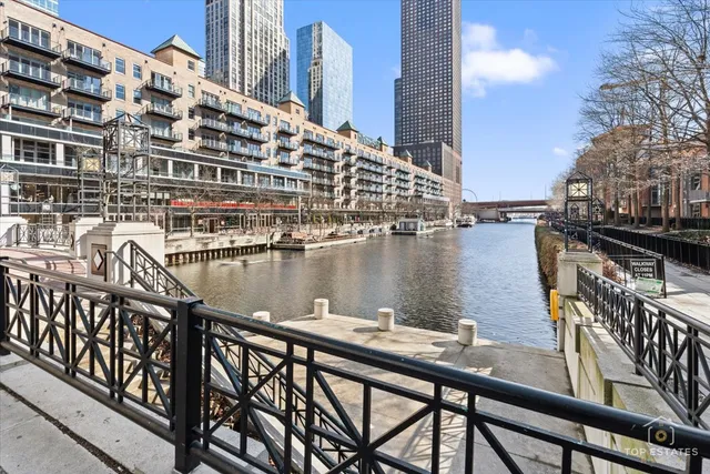 a view of swimming pool with outdoor seating and city view