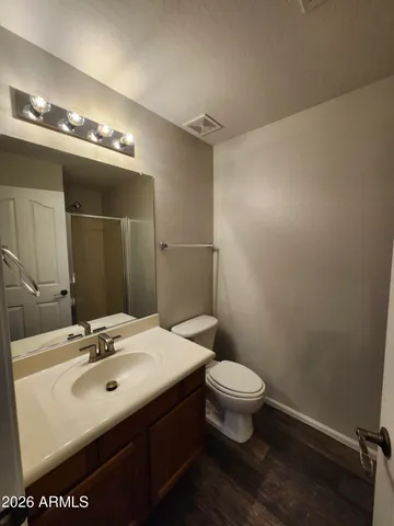 a bathroom with a toilet and shower