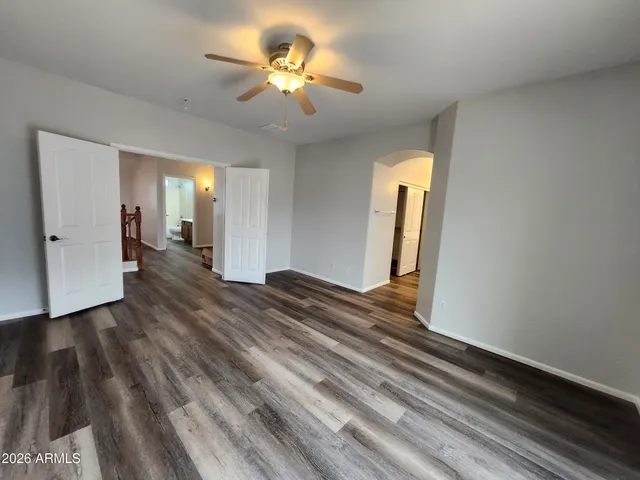 a bathroom with double vanity sink a mirror and a shower