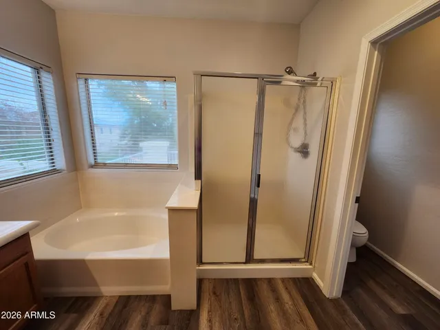 a spacious bathroom with a double vanity sink and a mirror