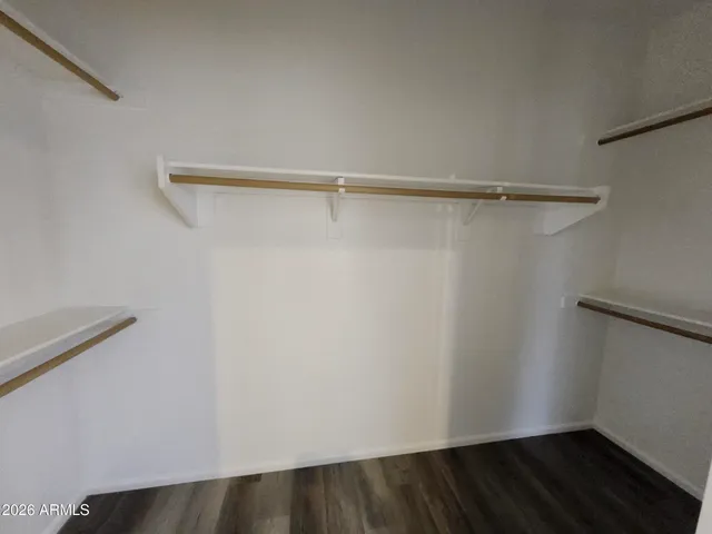 a bathroom with a double vanity sink toilet and shower