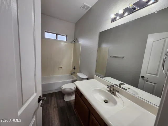 a view of room with window and ceiling fan