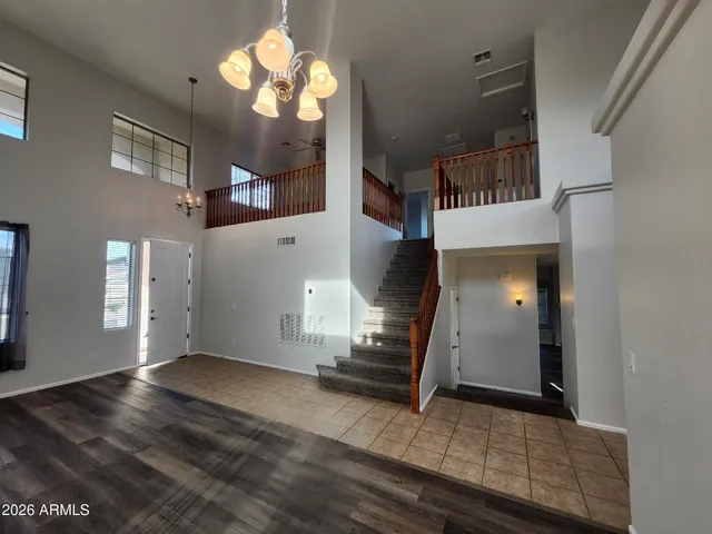 a kitchen with a sink a counter top space cabinets and stainless steel appliances