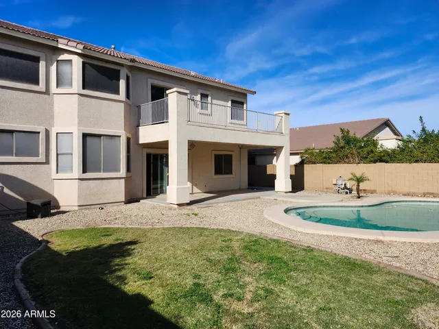 a view of a swimming pool with a backyard