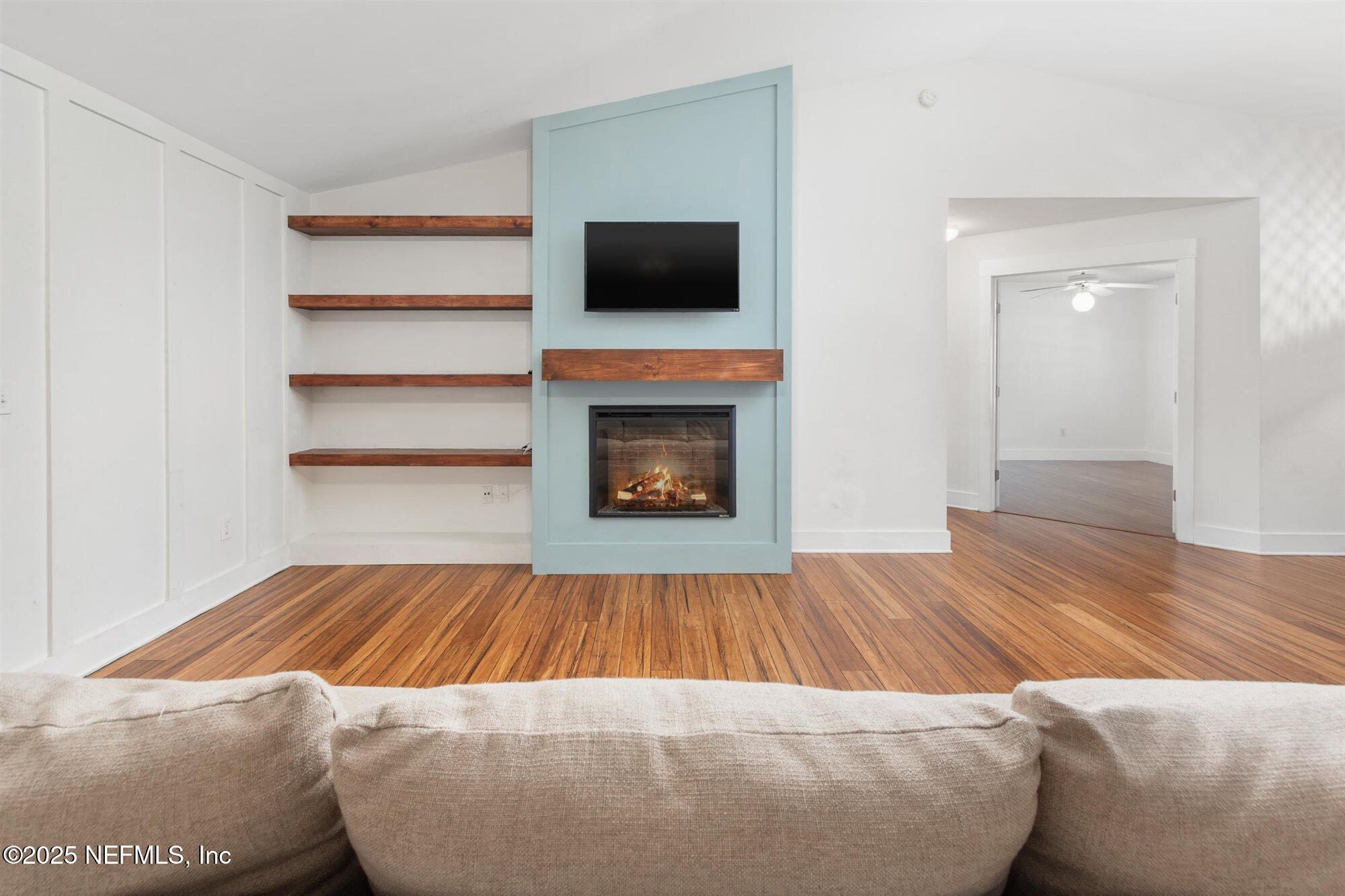 113 Mohegan Road St. Augustine, FL 32086 - Photo 11 of 56 a bedroom with a bed and a fireplace