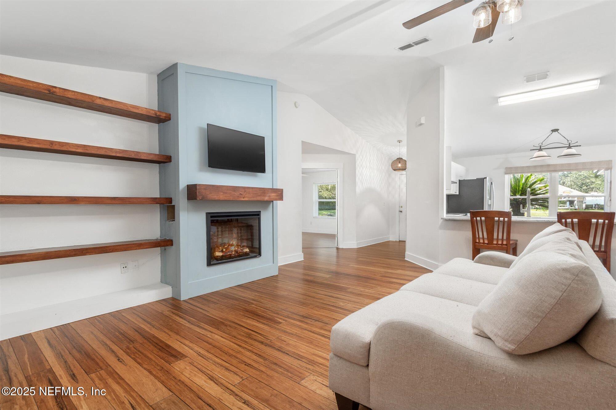 113 Mohegan Road St. Augustine, FL 32086 - Photo 12 of 56 a living room with furniture and a fireplace