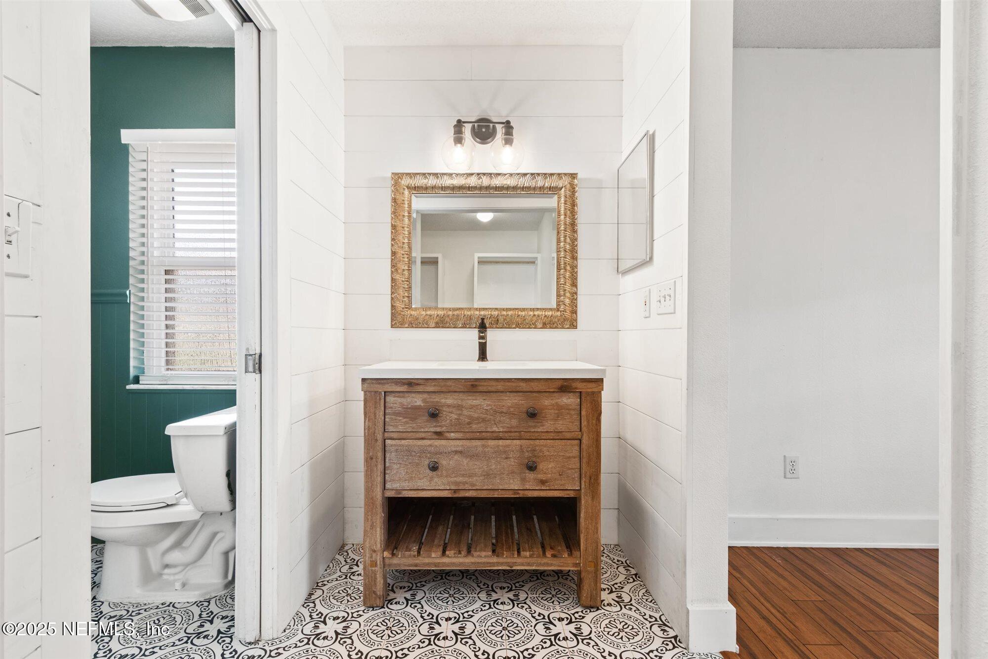 113 Mohegan Road St. Augustine, FL 32086 - Photo 24 of 56 a bathroom with a sink toilet and mirror
