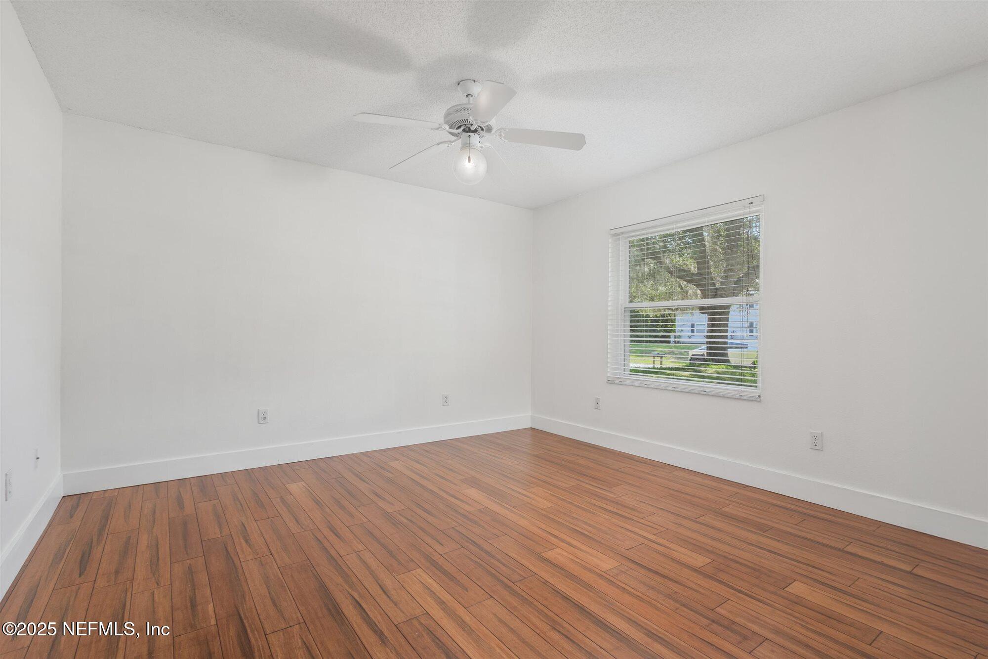 113 Mohegan Road St. Augustine, FL 32086 - Photo 30 of 56 wooden floor in an empty room with a window