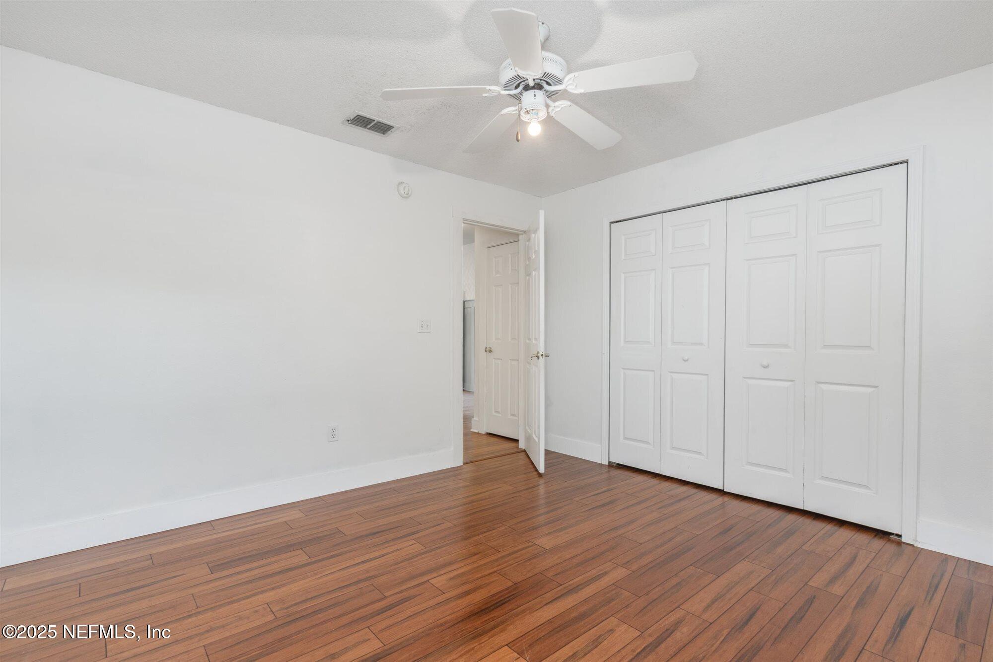 113 Mohegan Road St. Augustine, FL 32086 - Photo 31 of 56 a view of an empty room with wooden floor