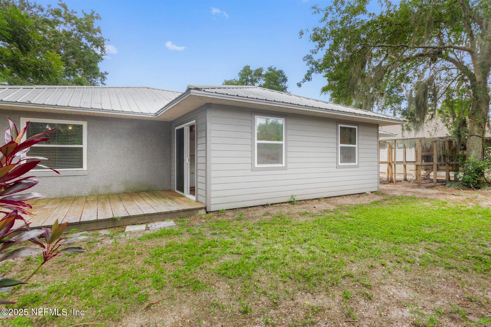 113 Mohegan Road St. Augustine, FL 32086 - Photo 37 of 56 a view of a backyard with a garden and plants