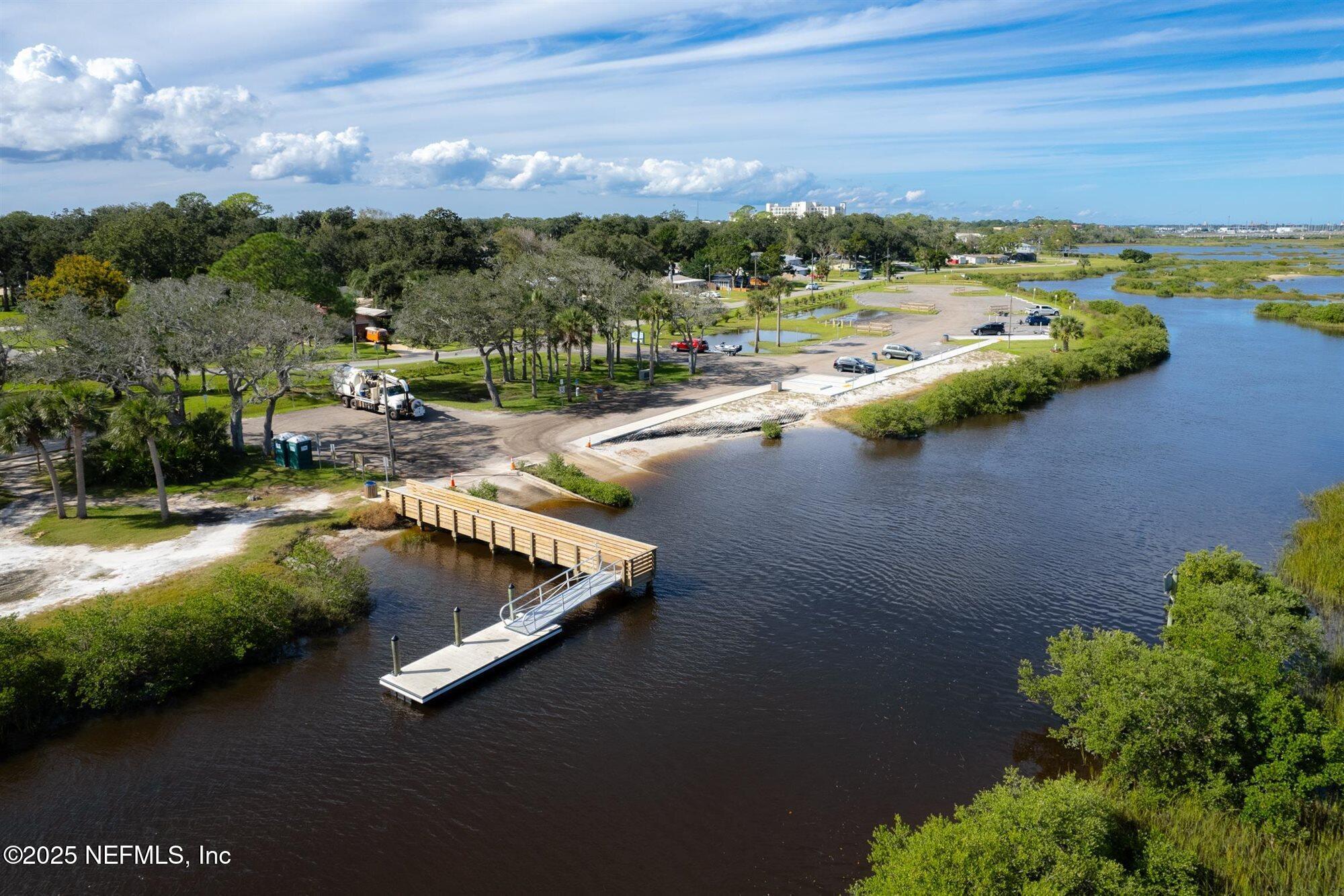 113 Mohegan Road St. Augustine, FL 32086 - Photo 47 of 56 an aerial view of a house with a garden and lake view