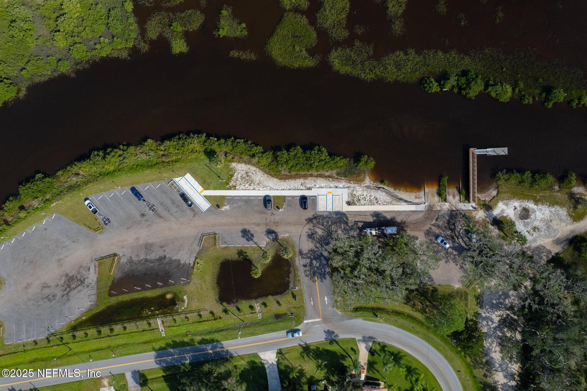 113 Mohegan Road St. Augustine, FL 32086 - Photo 50 of 56 an aerial view of a house with a yard