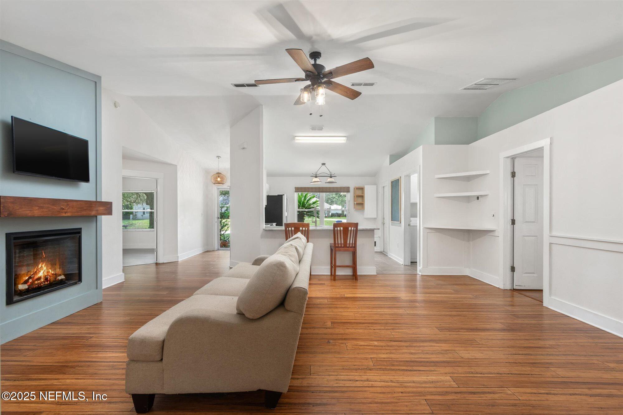 113 Mohegan Road St. Augustine, FL 32086 - Photo 5 of 56 a living room with furniture and a fireplace