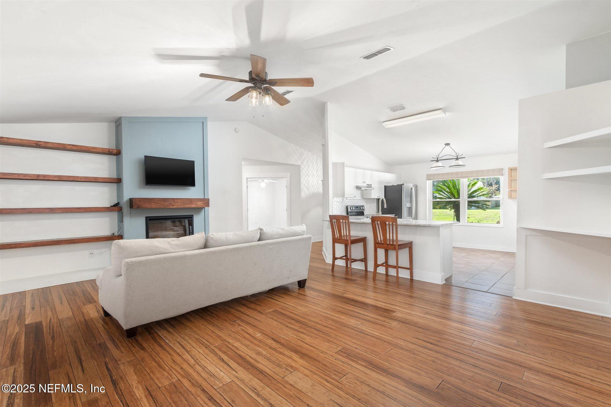 113 Mohegan Road St. Augustine, FL 32086 - Photo 6 of 56 a living room with furniture and a wooden floor