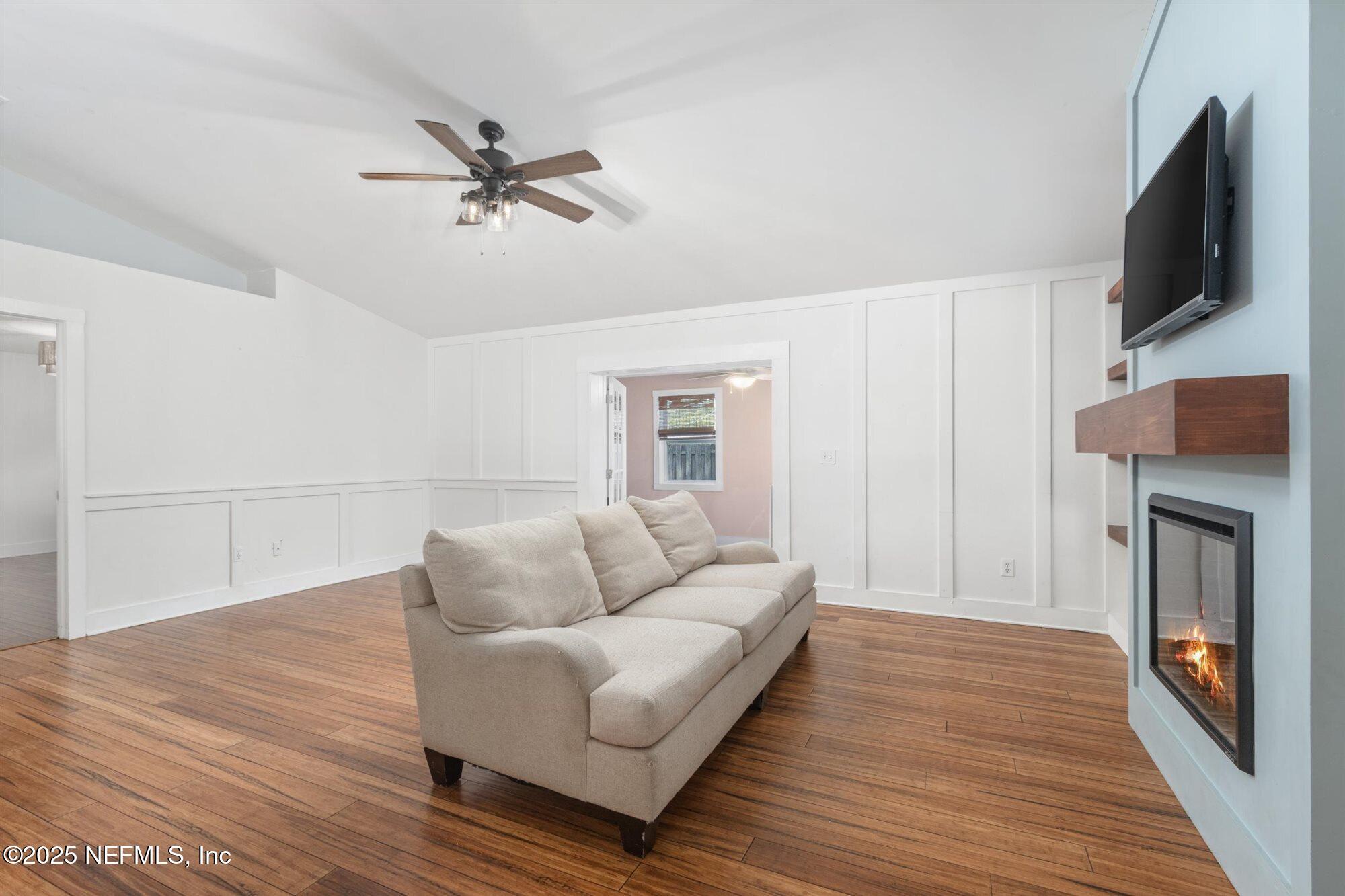 113 Mohegan Road St. Augustine, FL 32086 - Photo 9 of 56 a living room with furniture and a flat screen tv
