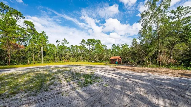 a view of a playground with basketball court