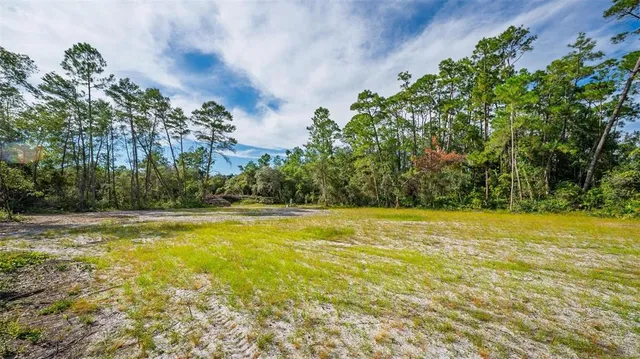 a view of a swimming pool with an outdoor space and seating area