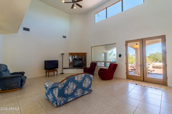 a living room with furniture and a large window