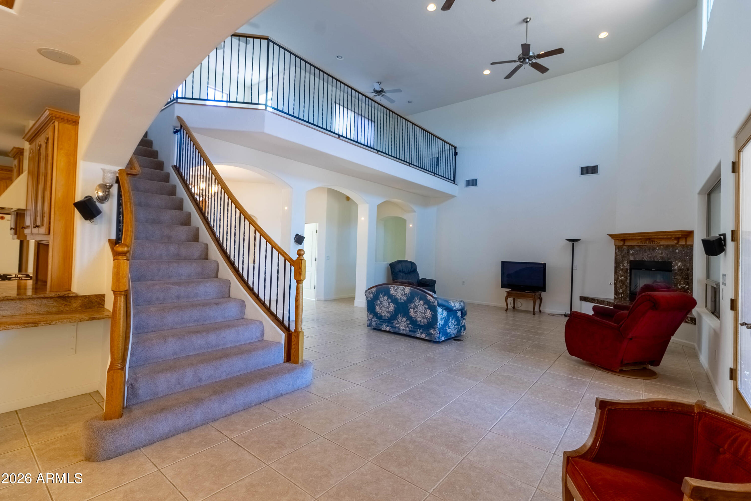 5159 North Lak A Yucca Road Tucson, AZ 85743 - Photo 15 of 66 a living room with furniture and a fireplace