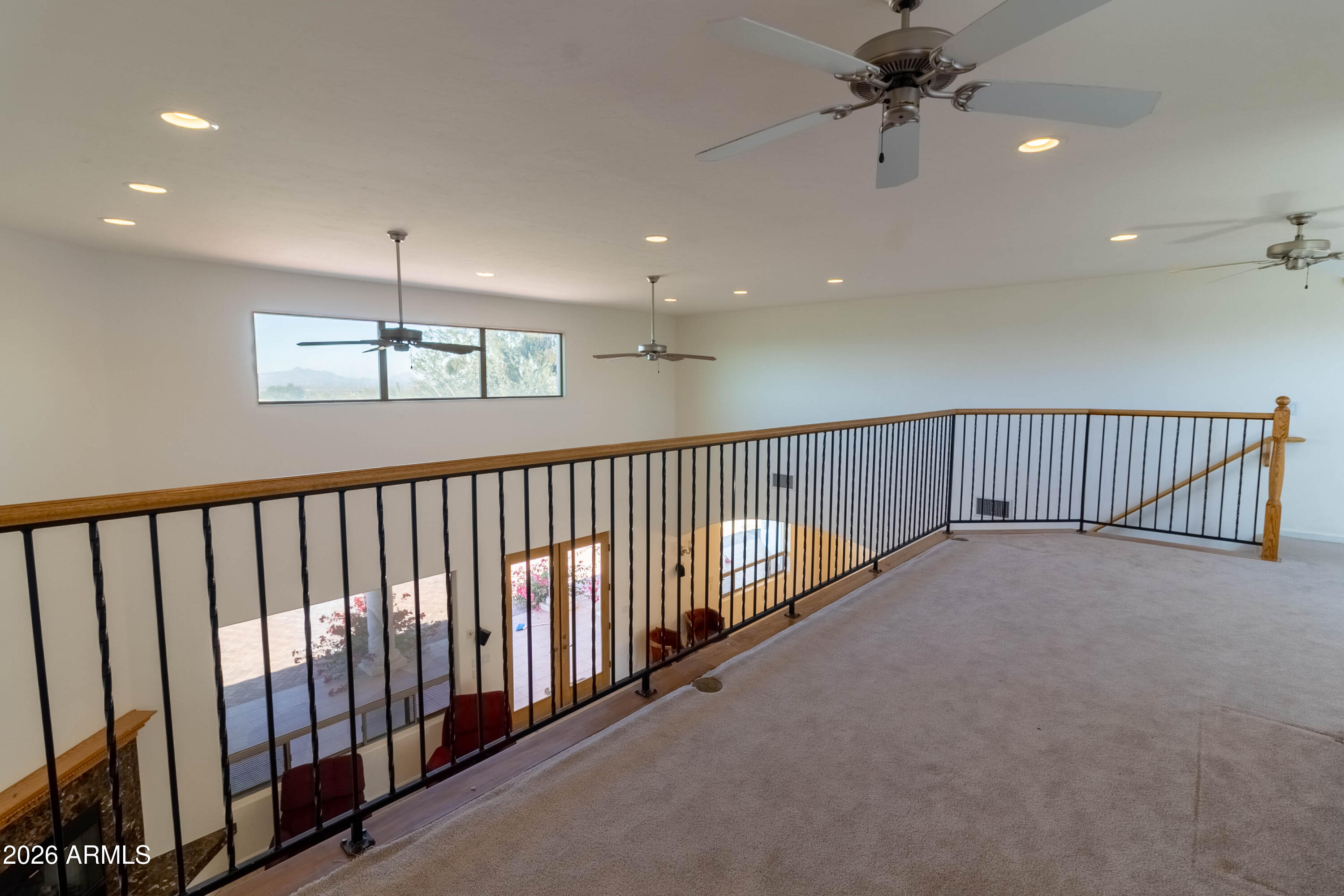 5159 North Lak A Yucca Road Tucson, AZ 85743 - Photo 17 of 66 a view of a hallway with a chandelier