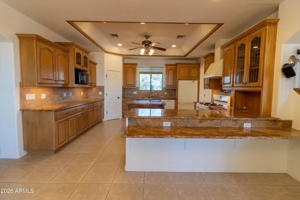 a bed room with a bed and a chandelier