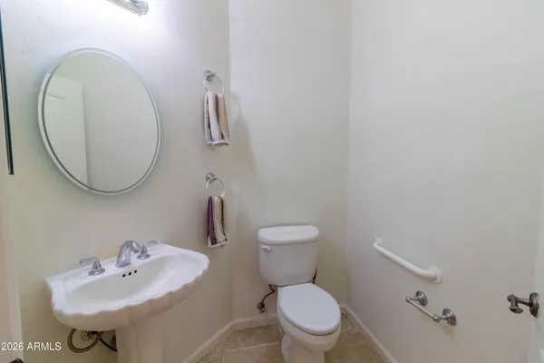 a view of an empty room with closet and entertaining space