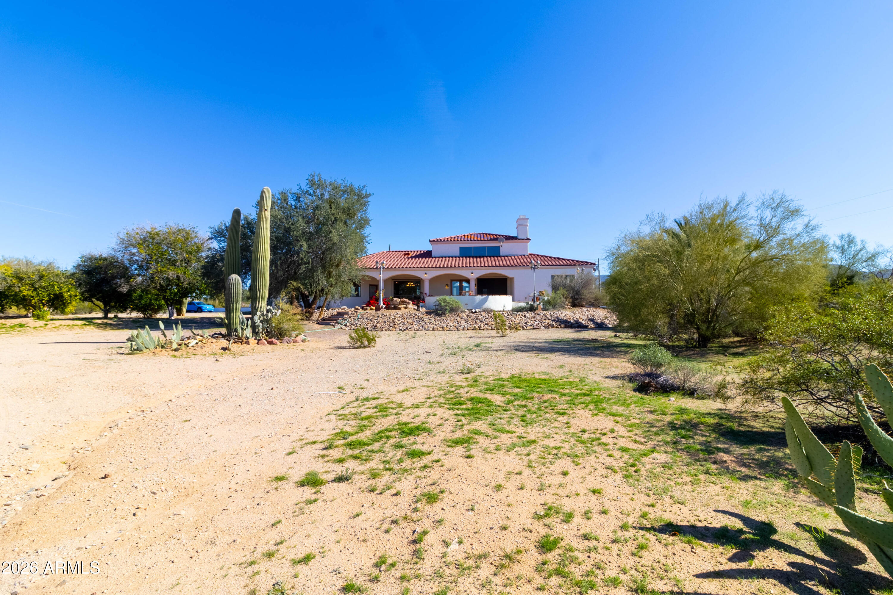 5159 North Lak A Yucca Road Tucson, AZ 85743 - Photo 41 of 66 a view of swimming pool with outdoor seating and house in the background