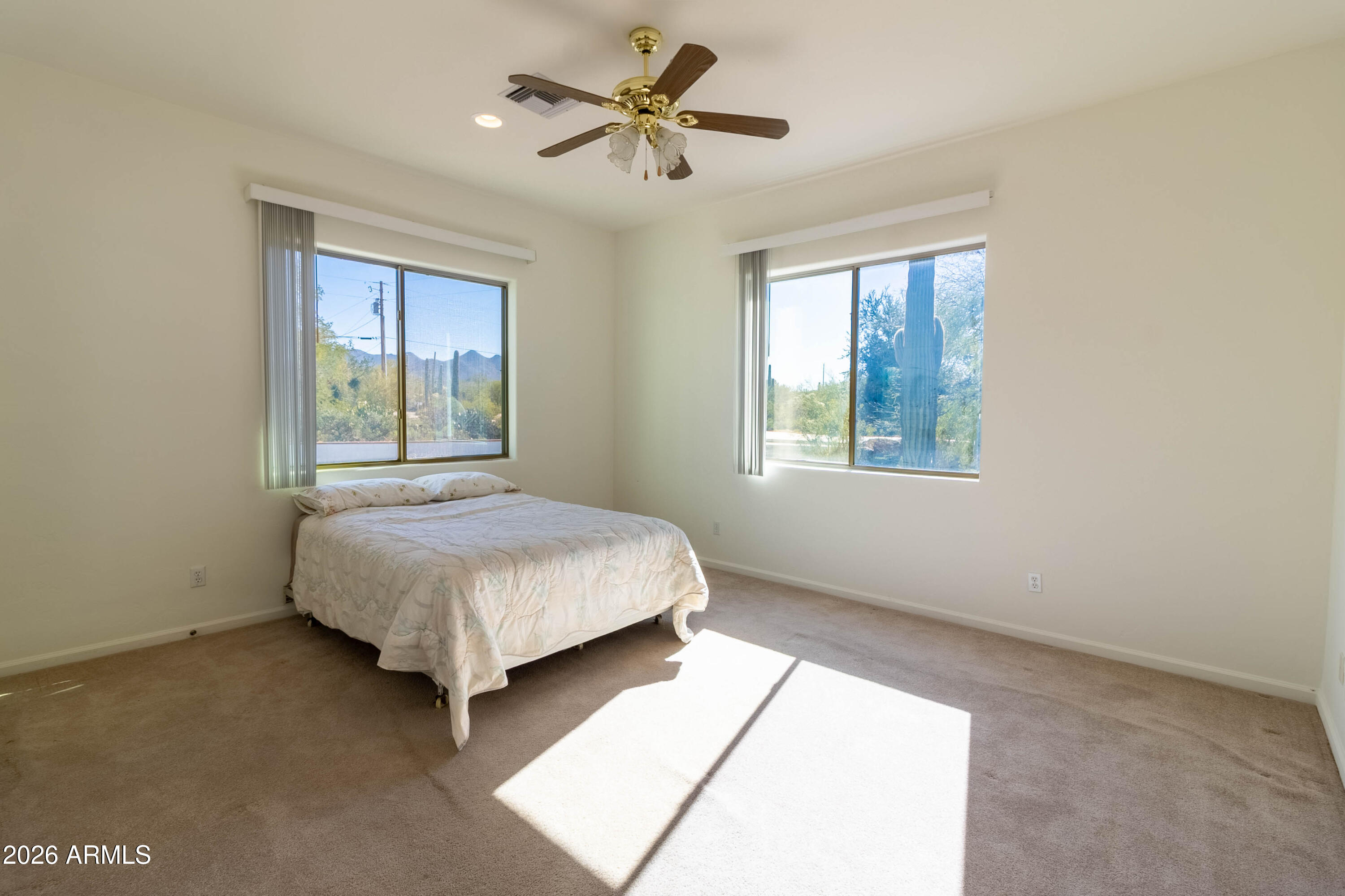 5159 North Lak A Yucca Road Tucson, AZ 85743 - Photo 5 of 66 a bedroom with a bed dresser and a window