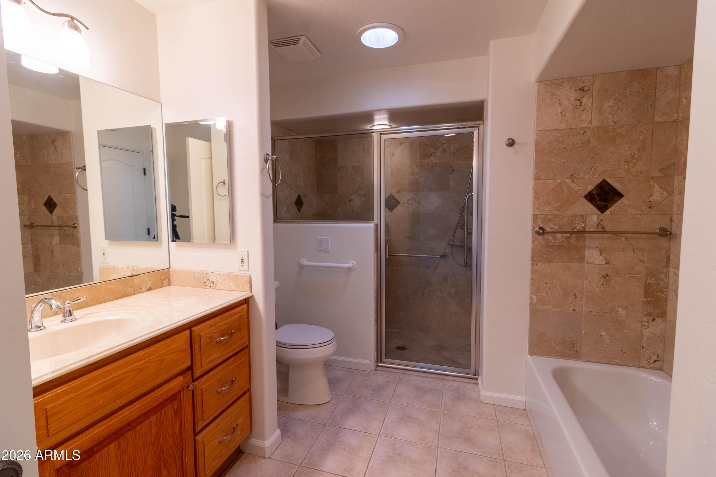 5159 North Lak A Yucca Road Tucson, AZ 85743 - Photo 7 of 66 a bathroom with a granite countertop sink toilet and shower