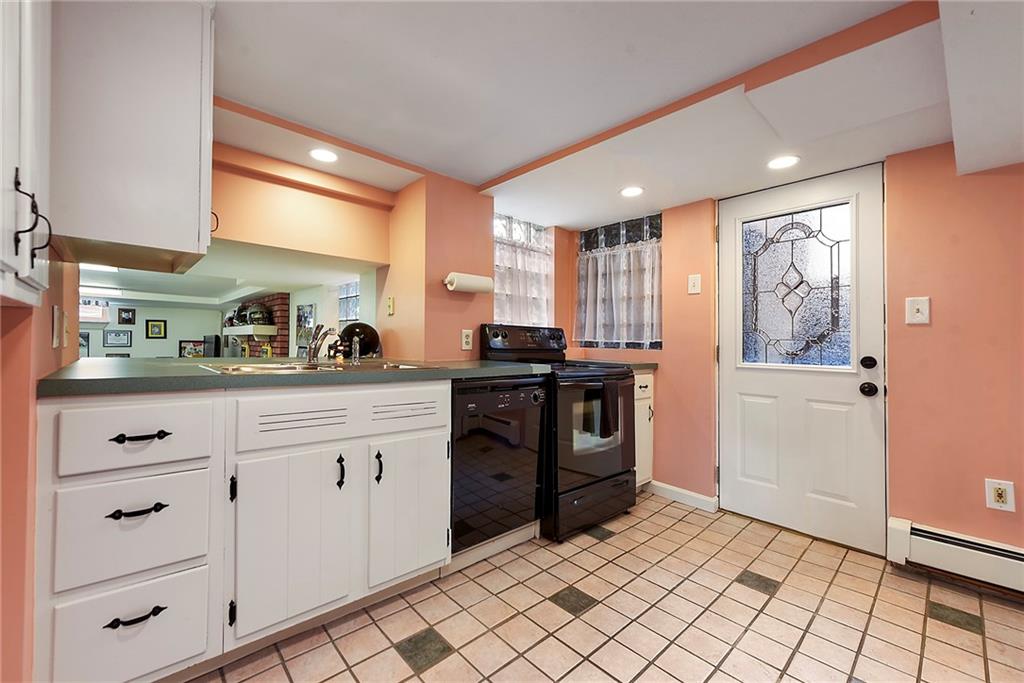 637 East McMurray Road Canonsburg, PA 15317 - Photo 35 of 50 a kitchen with granite countertop white cabinets and stainless steel appliances