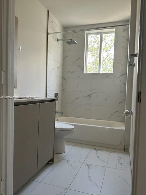 2561 Northeast 193rd Street, Unit 1207 Miami, FL 33180 - Photo 14 of 21 a bathroom with a bathtub and a shower