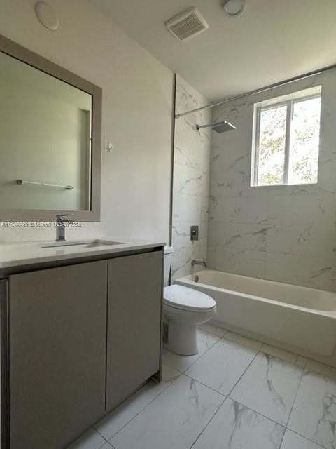 2561 Northeast 193rd Street, Unit 1207 Miami, FL 33180 - Photo 15 of 21 a bathroom with a toilet sink and bathtub