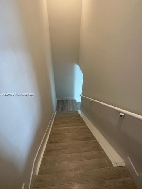 2561 Northeast 193rd Street, Unit 1207 Miami, FL 33180 - Photo 19 of 21 a view of a hallway with wooden floor
