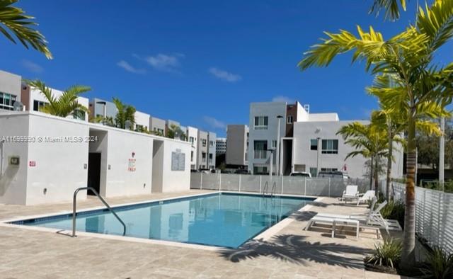 2561 Northeast 193rd Street, Unit 1207 Miami, FL 33180 - Photo 20 of 21 a view of a building with a swimming pool