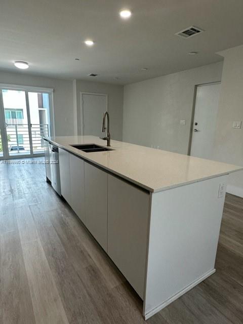 2561 Northeast 193rd Street, Unit 1207 Miami, FL 33180 - Photo 7 of 21 a kitchen with sink and wooden floor