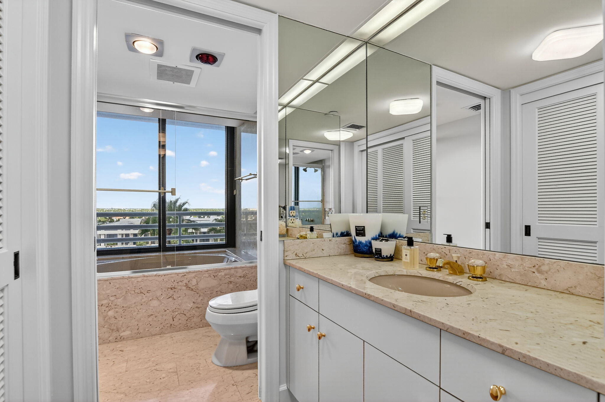1500 South Ocean Boulevard, Unit 704 Boca Raton, FL 33432 - Photo 28 of 78 a bathroom with a granite countertop sink toilet and shower