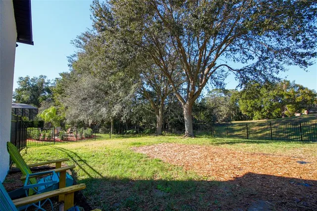 a kitchen with stainless steel appliances a stove and wooden floor