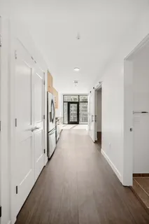 a view of a big room with windows and cabinet