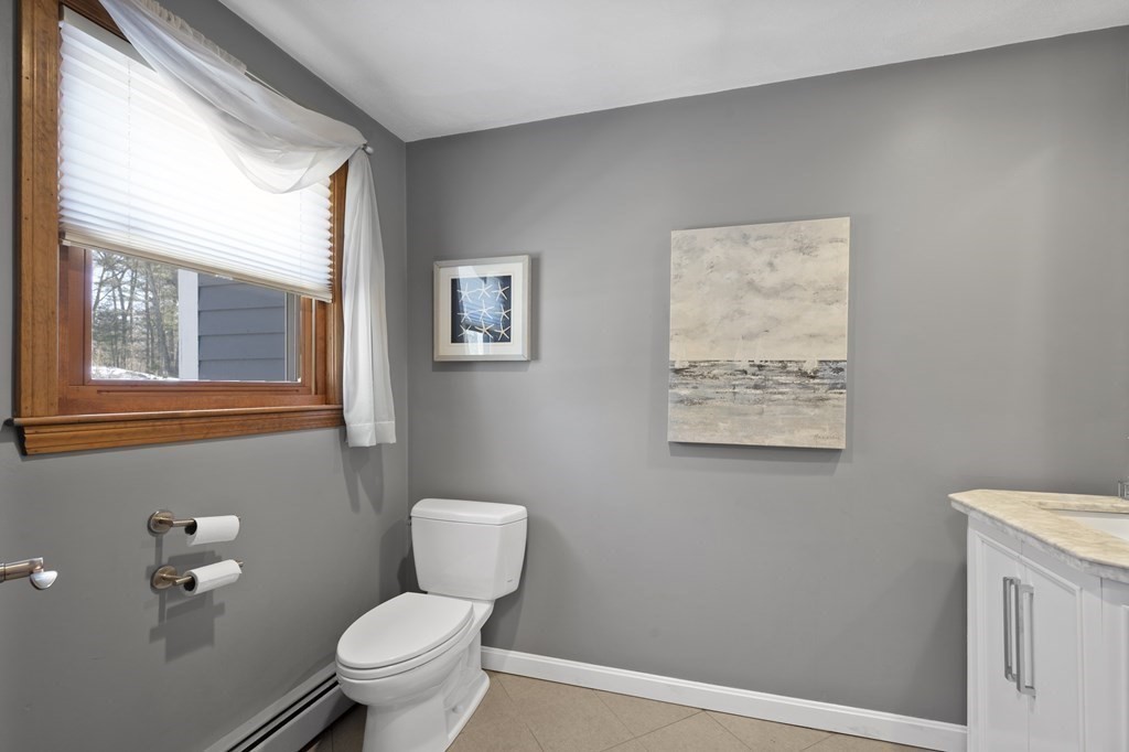 8 Penbrook Circle Andover, MA 01810 - Photo 13 of 42 a bathroom with a toilet sink and mirror