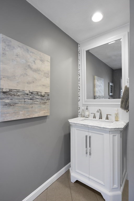 8 Penbrook Circle Andover, MA 01810 - Photo 14 of 42 a bathroom with a sink a vanity and a mirror