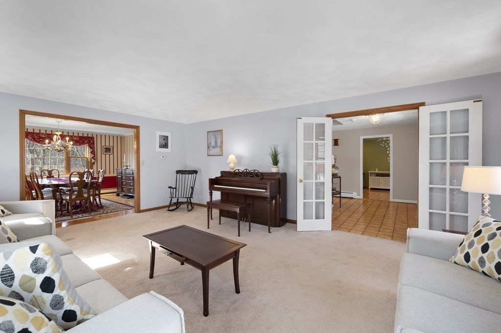 8 Penbrook Circle Andover, MA 01810 - Photo 16 of 42 a living room with furniture and a couch