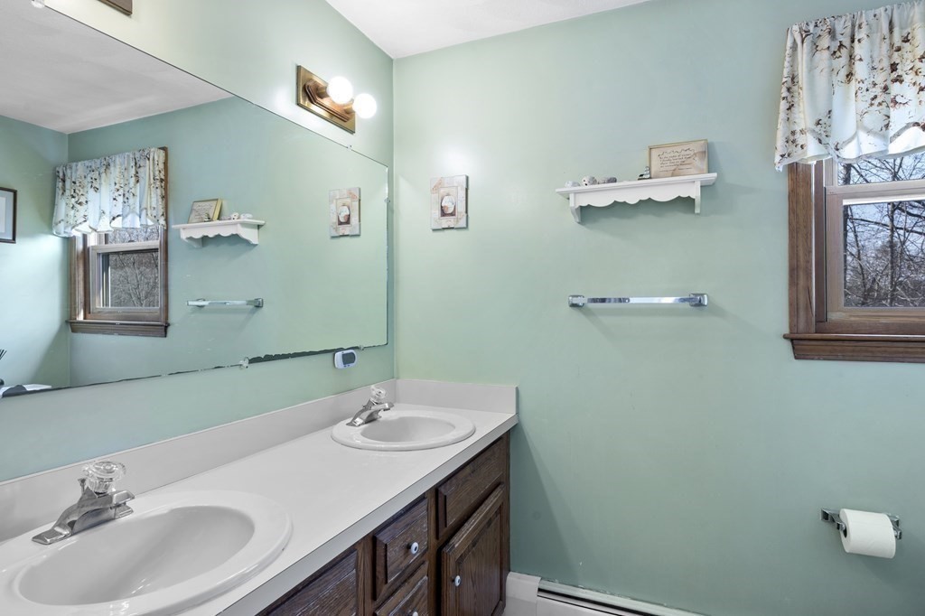 8 Penbrook Circle Andover, MA 01810 - Photo 22 of 42 a bathroom with a sink and a mirror