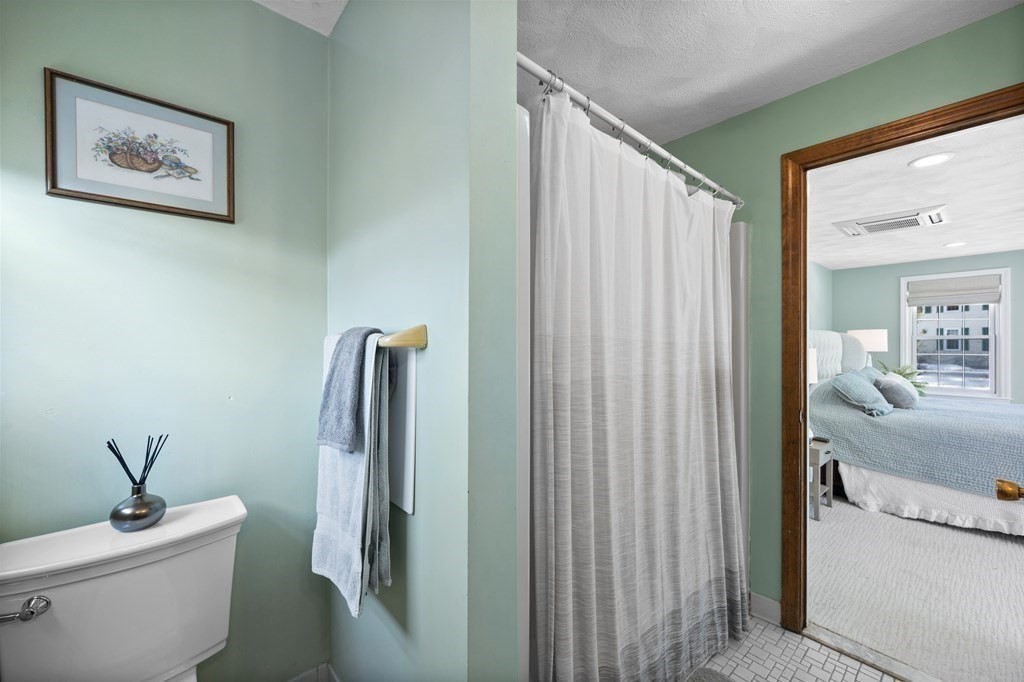 8 Penbrook Circle Andover, MA 01810 - Photo 23 of 42 a bathroom with a sink a toilet and shower curtain