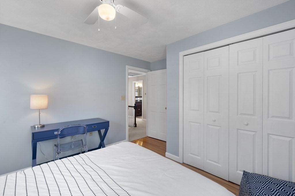 8 Penbrook Circle Andover, MA 01810 - Photo 27 of 42 a bedroom with a bed and a lamp