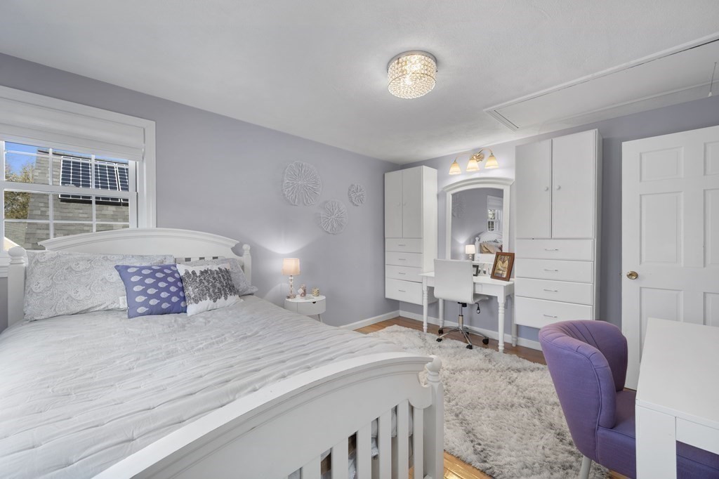 8 Penbrook Circle Andover, MA 01810 - Photo 28 of 42 a bedroom with a bed a table and chair
