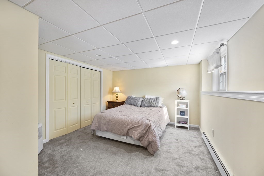 8 Penbrook Circle Andover, MA 01810 - Photo 34 of 42 a bedroom with a bed and a window