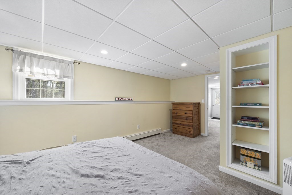 8 Penbrook Circle Andover, MA 01810 - Photo 35 of 42 a room with furniture and a window