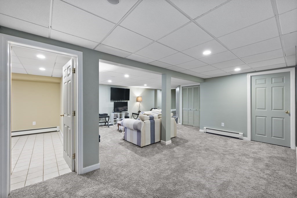 8 Penbrook Circle Andover, MA 01810 - Photo 37 of 42 a view of a livingroom with furniture and windows