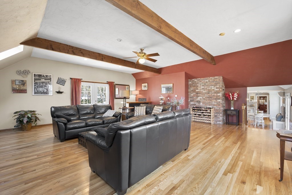 8 Penbrook Circle Andover, MA 01810 - Photo 10 of 42 a living room with furniture and a wooden floor