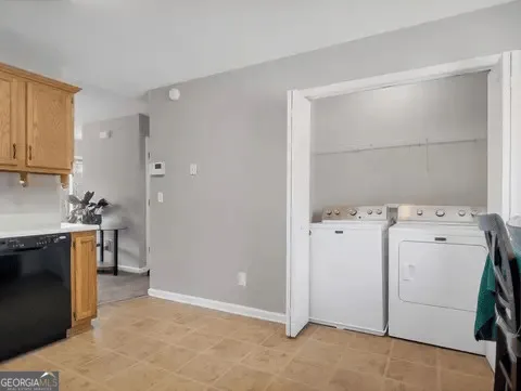 a view of storage and utility room with washer and dryer